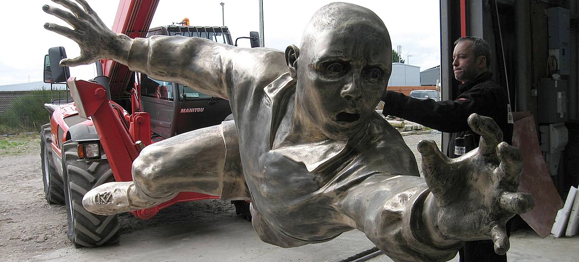Closeup of a figure for Twickenham's Lineout sculpture being loaded for the journey